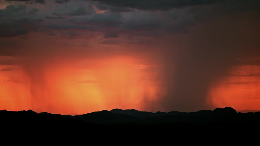 Lightning flashes during a sunset storm