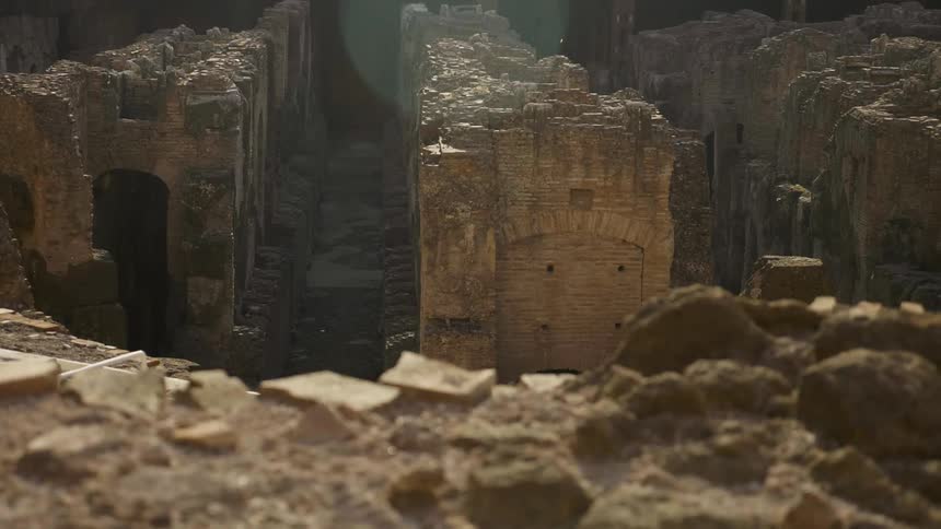 Old rock ruins are shown on a sunny day