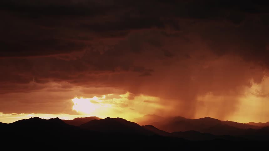 Lightning flashes from storm clouds over peaks