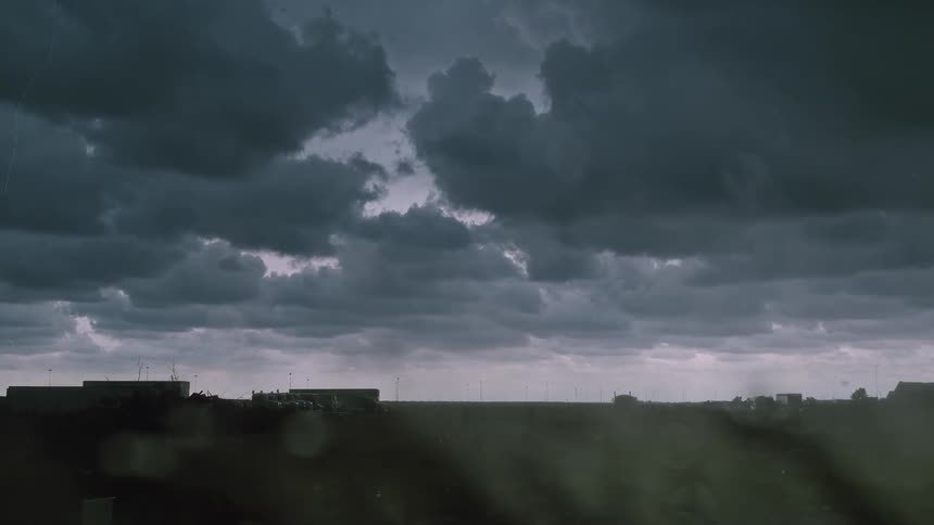 Lightning striking plains as rain falls