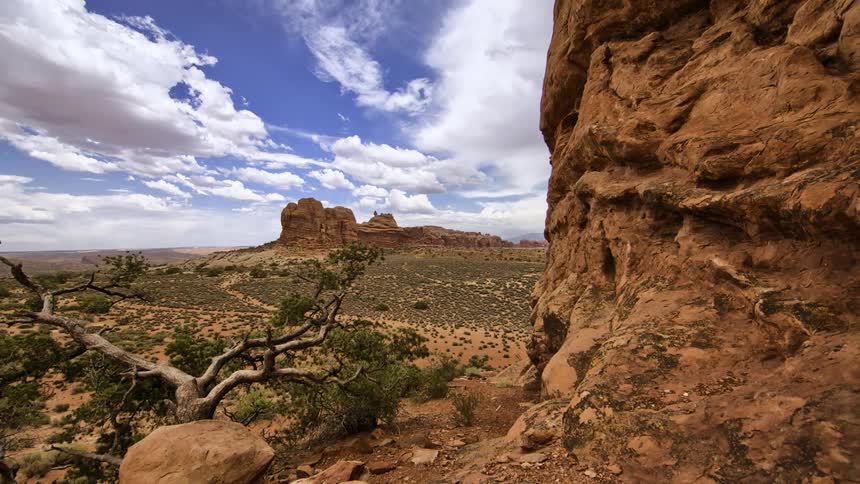 Clouds roll across monument valley during the day
