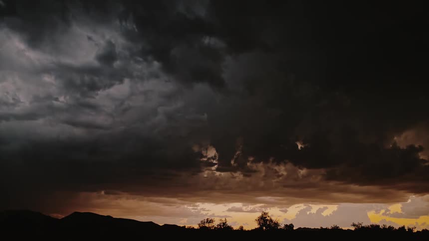 Lightning flashing in the sky at sunset