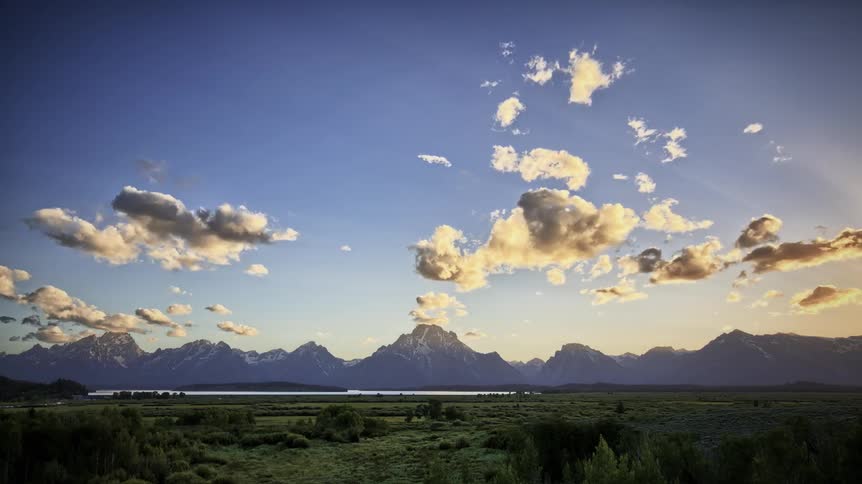 Clouds roll over grassy plains