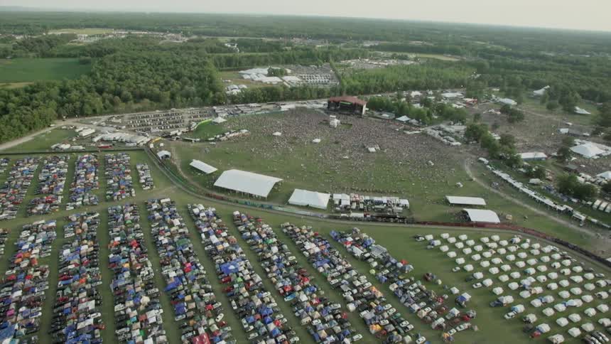 Aerial view of a large parking lot next to a venue