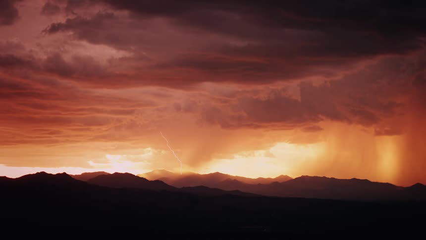 The dawn sky is full of heavy storm clouds pouring rain
