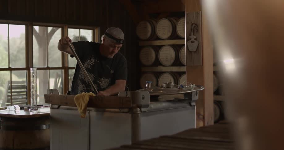 A man is working in a distillery