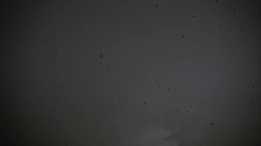 Soot falls through smoky air