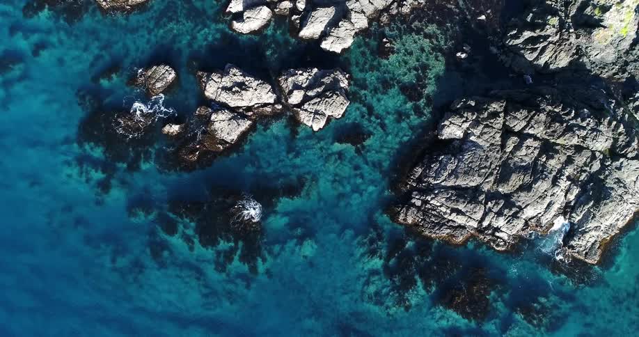 Overhead view of rocks and the ocean