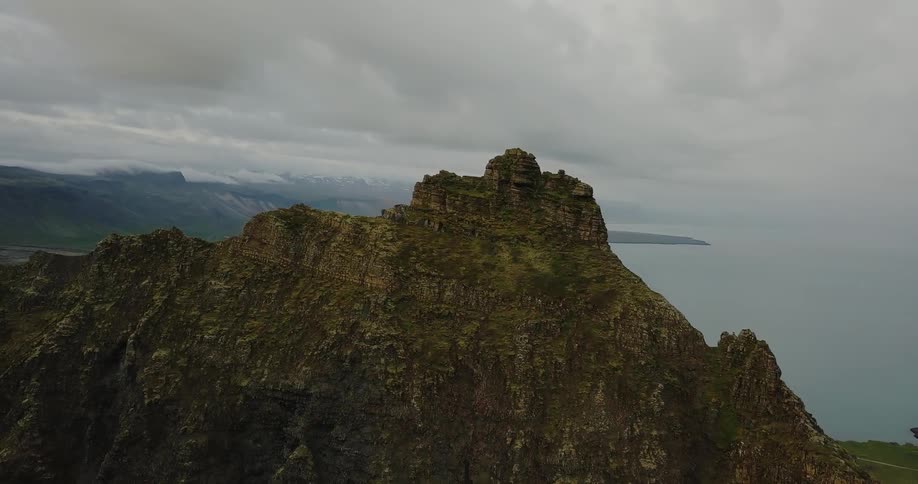 Hilly terrain next to a large body of water