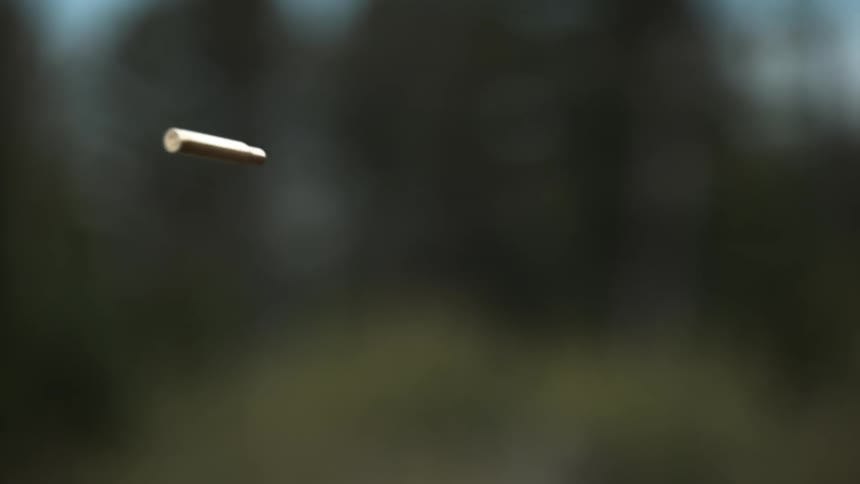 A bullet rotates as it is thrown through the air