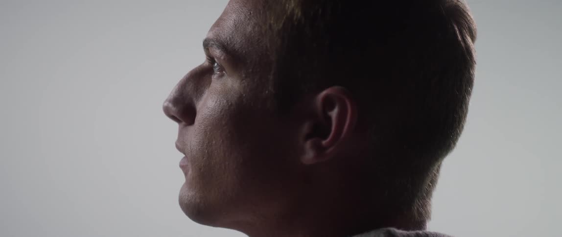 Man slowly looks up