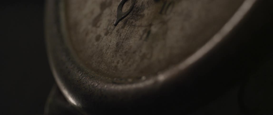 The rusted face of a compass