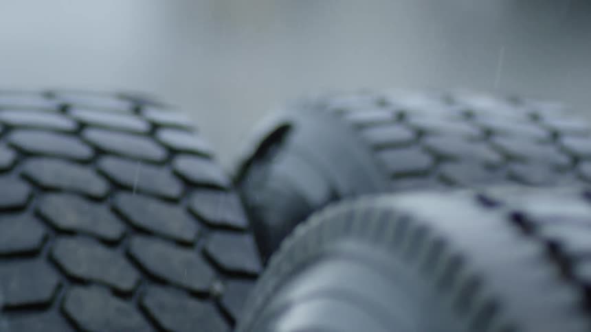 Some tires with rain dropping on top