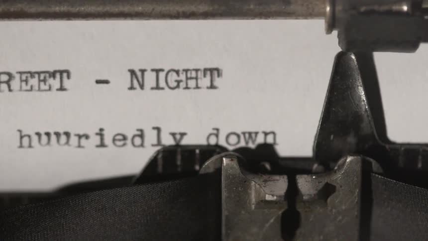 A type writer working typing out words