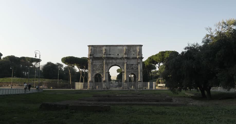 A fenced in stone archway