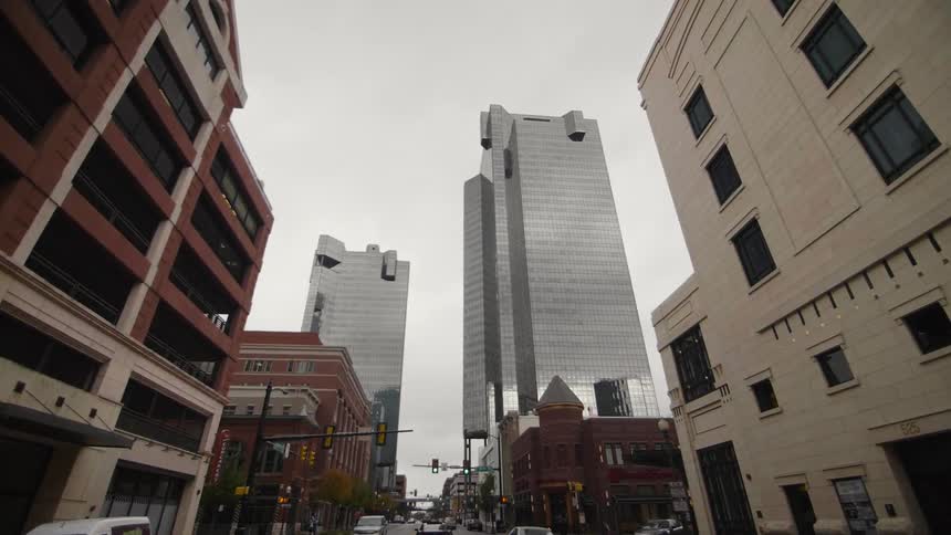 Traveling view going down a street in the downtown of a city