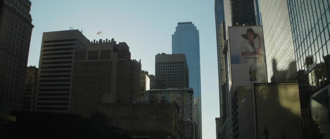 Tall city skyscrapers stand ahead