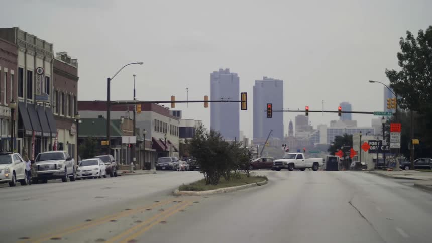Traffic proceeds through a crossing during the day