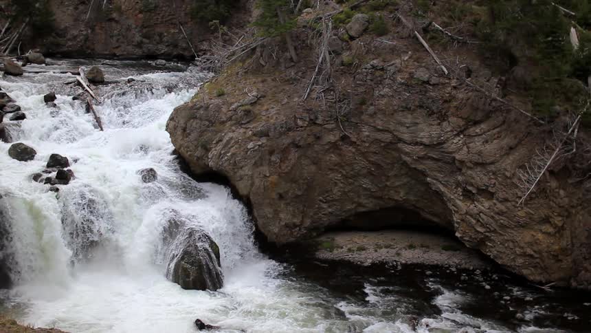 Water splashes down rocks in a river
