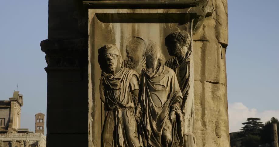 Stone carving of four people
