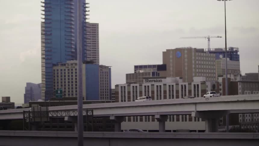 Cars driving on a bridge in a city