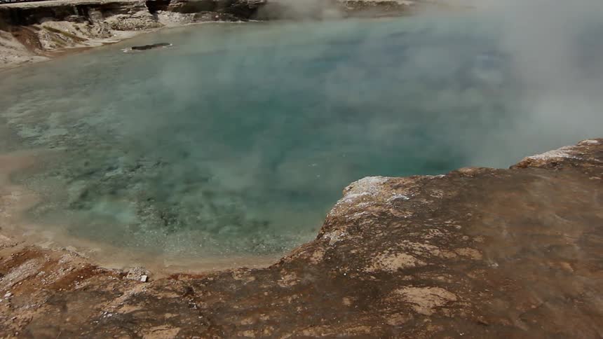 Steam rolls off a small pool