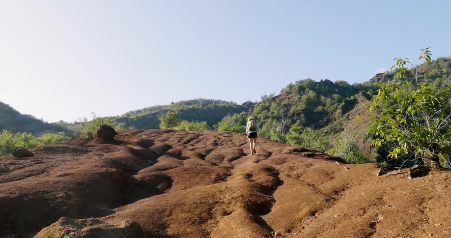 A person hiking down a dirt path