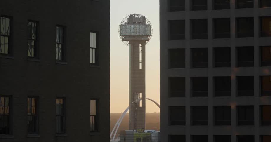 View looking between two buildings at a tower