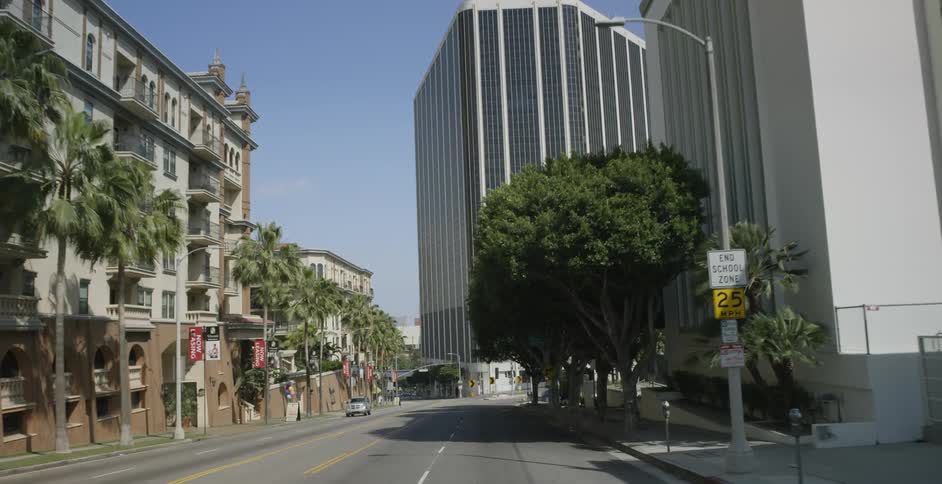 A car travels on a city street