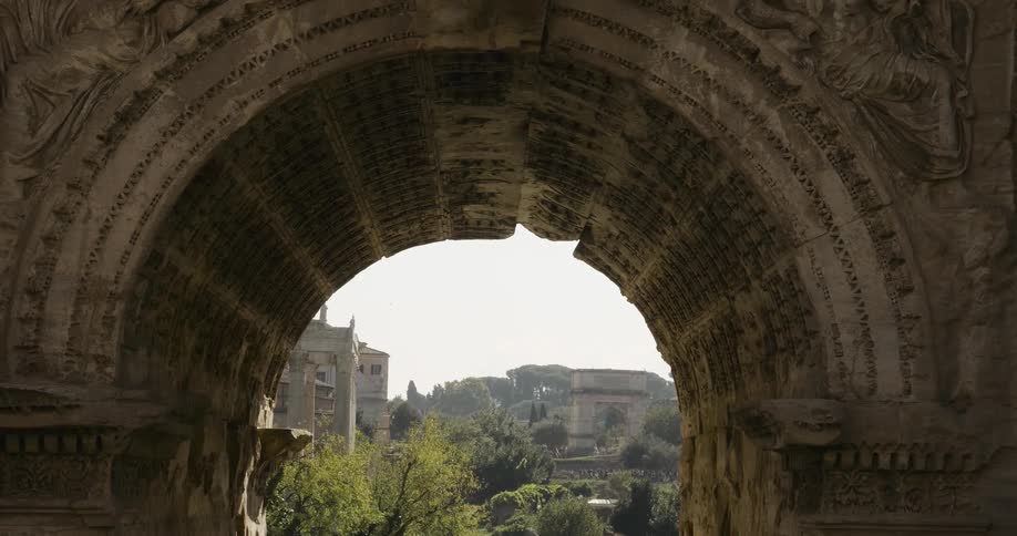 View looking through a tunnel at buildings