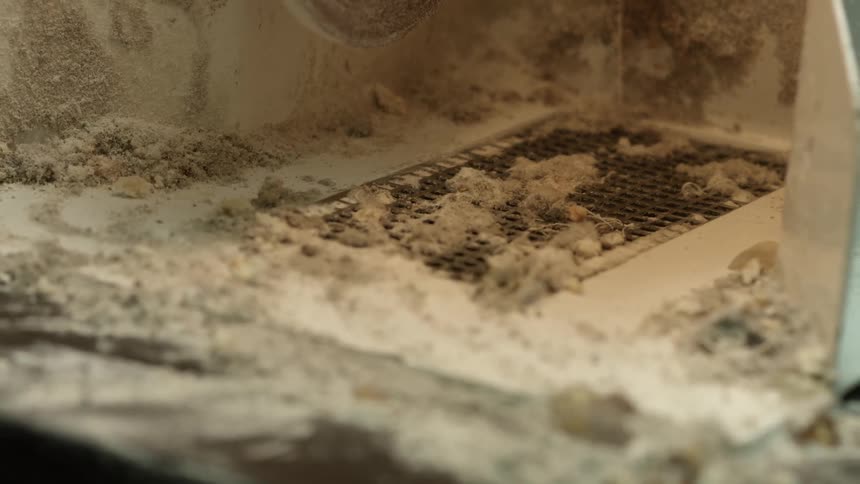 The grate is dirty and full of sand