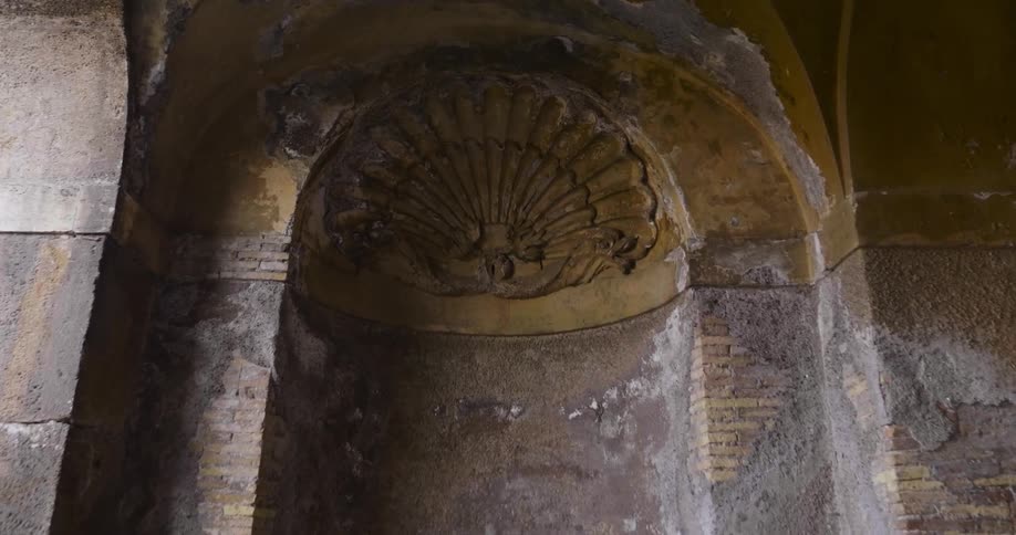 Carving on the side of a wall in an old building