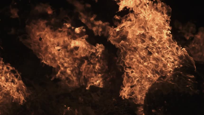 Flames burn and throw off embers