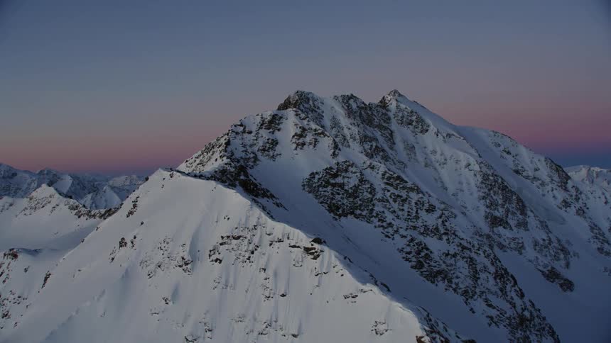 View of snowy mountains at sunset