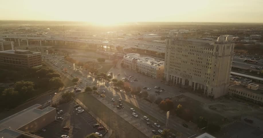 Traffic flows along a freeway and side streets at dawn