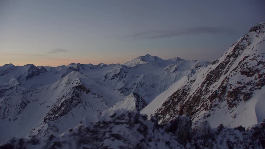 Snowy mountains at sunset
