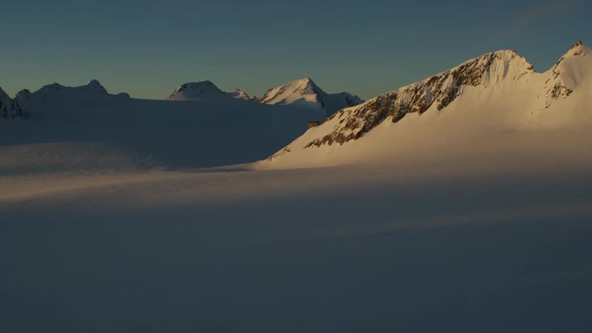 View of snowy mountains at sunset