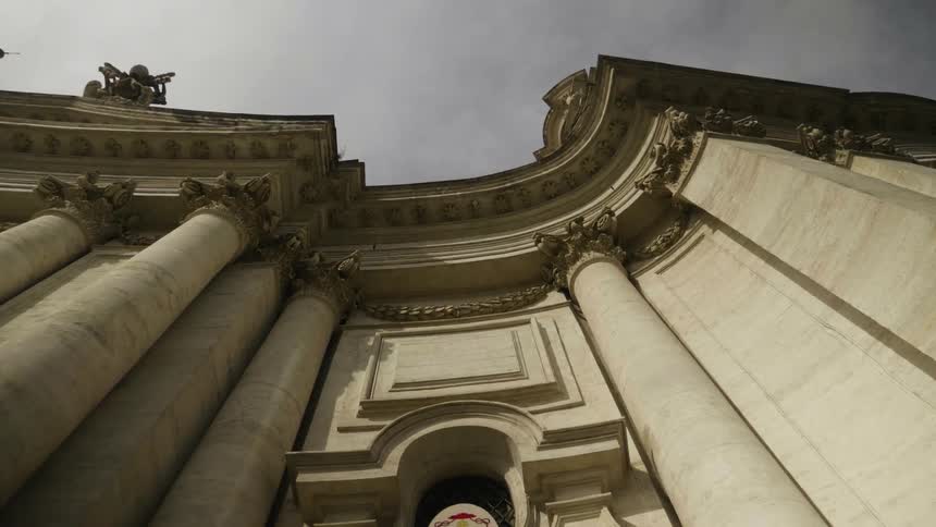 A large stone building on a cloudy day