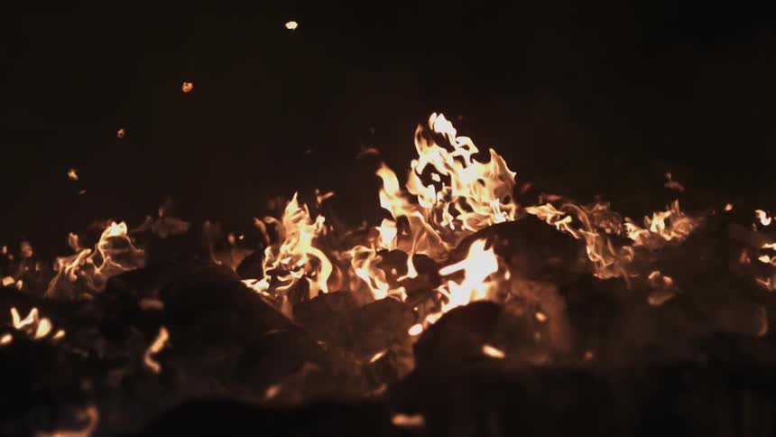 Fire burning brightly at night