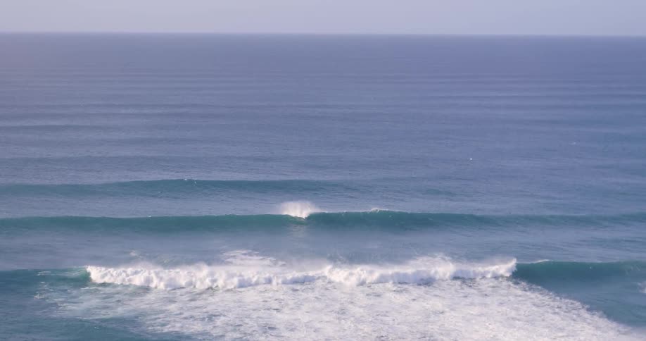 Ocean waves splashing on a cloudy day