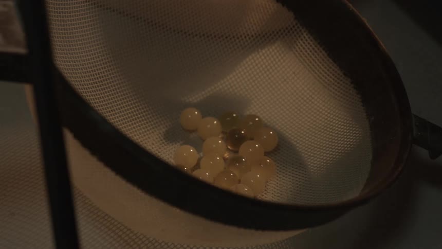 Beads are put into a strainer