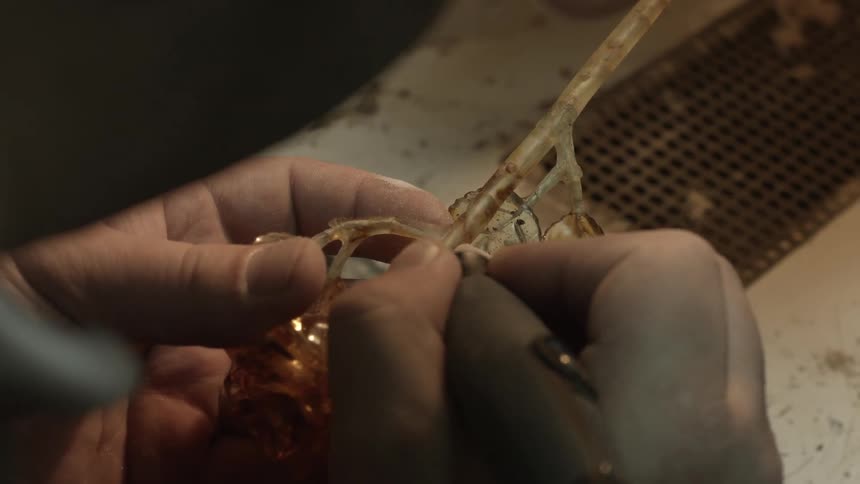 Person carves an object out of stone