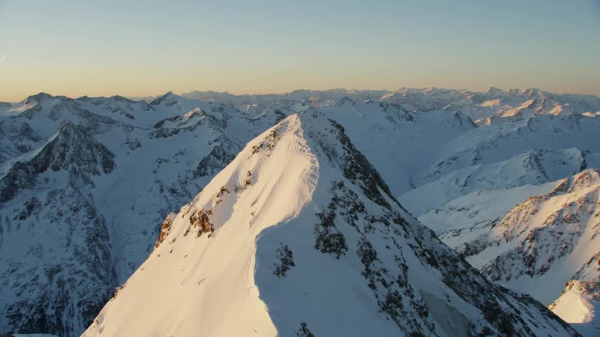 Snow covers a mountain ridge
