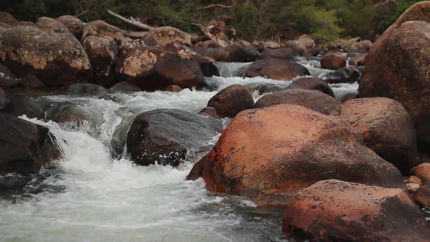 Water flowing through rocks in nature