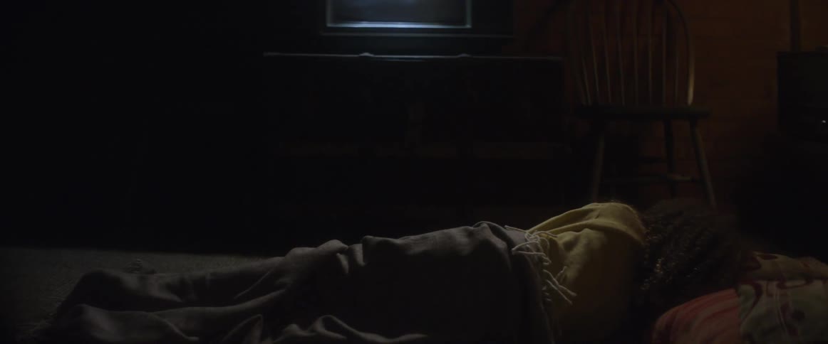 A person is sleeping in bed