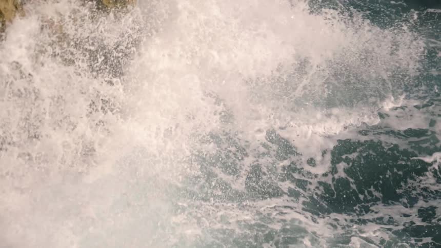 Waves crash onto a rocky shore