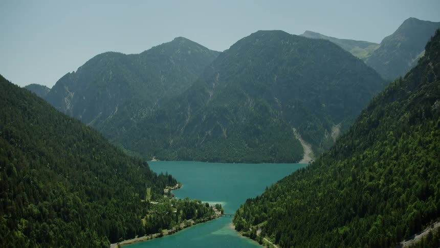 A wide river curving between mountains
