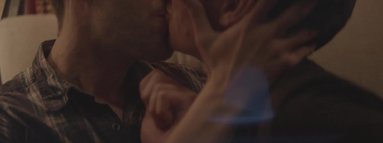 A man and woman kiss and make out