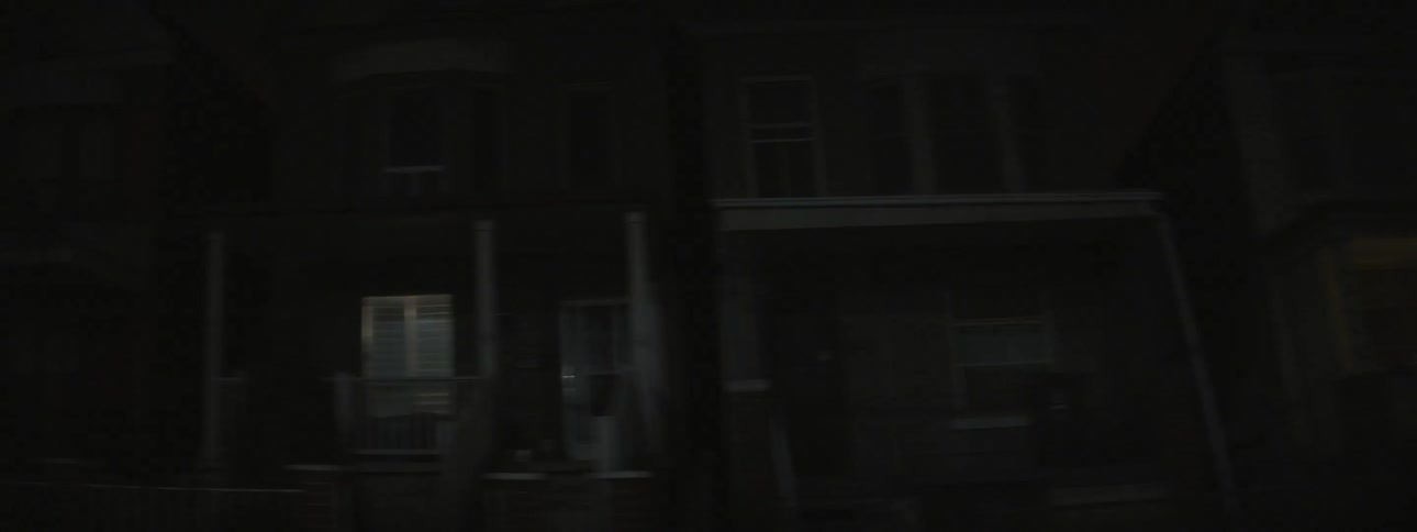 Moving down a dark neighborhood street at night
