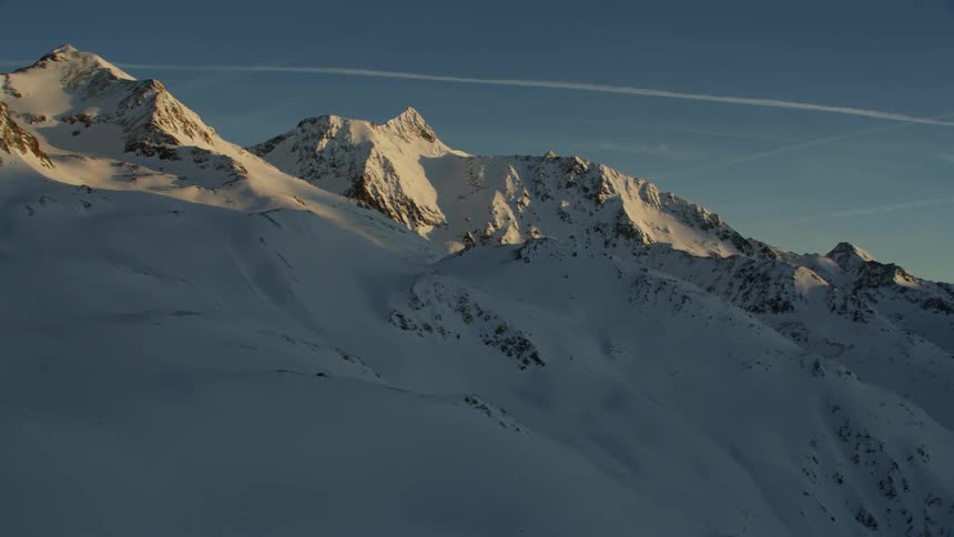 Snowy mountains at sunset